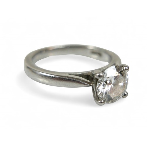 89 - A platinum diamond solitaire ring, the round brilliant cut stone 1.01ct with SI1 clarity, colour G, ... 