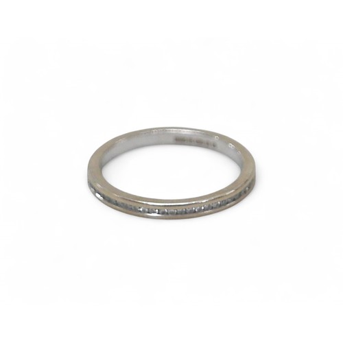 82 - An 18ct white gold diamond eternity ring, each stone approximately 1mm diameter, size K, 2.0g