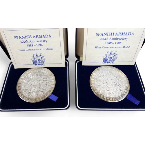 28 - Two silver Spanish Armada 400th anniversary medals and two silver coins, medals weigh 156g each. (4)