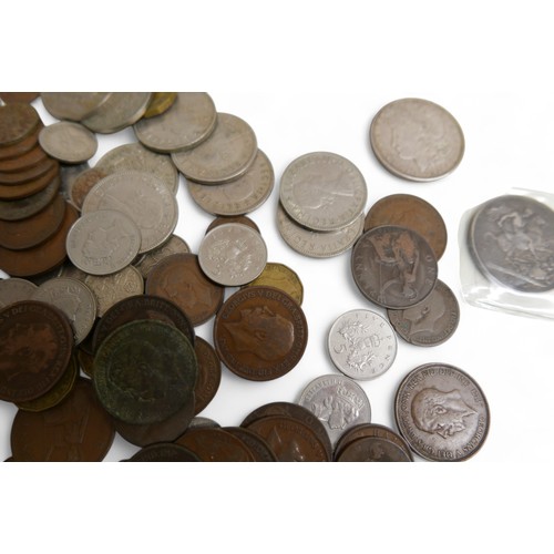 23 - A collection of Georgian and later coins, to include two Victorian crowns and a 1921 American dollar... 