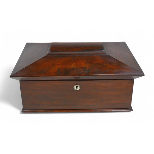 284 - A 19th century rosewood sarcophagus shaped tea caddy, 34 by 18 by 20cm high.