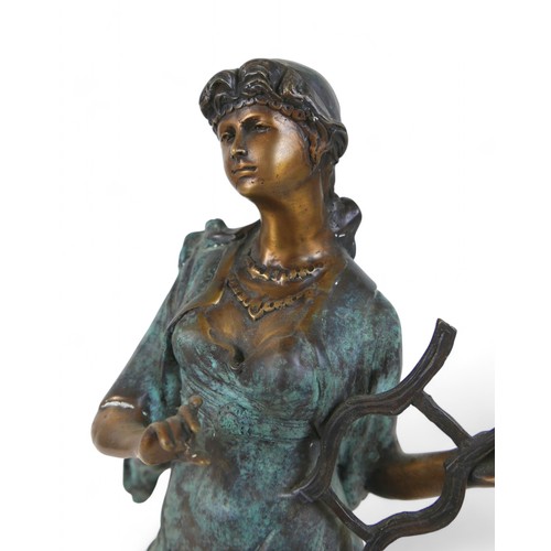 219 - A bronze classical figure playing a lyre, 14 by 16 by 53cm high.