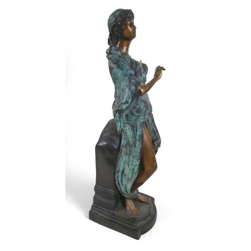 219 - A bronze classical figure playing a lyre, 14 by 16 by 53cm high.