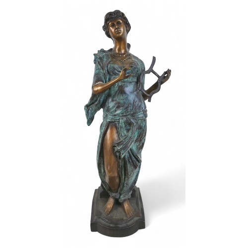 219 - A bronze classical figure playing a lyre, 14 by 16 by 53cm high.