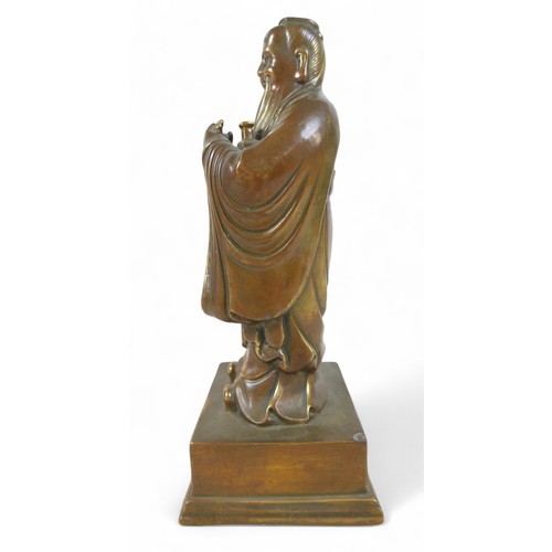 175 - A Chinese bronze figure, 13 by 11 by 29cm high.