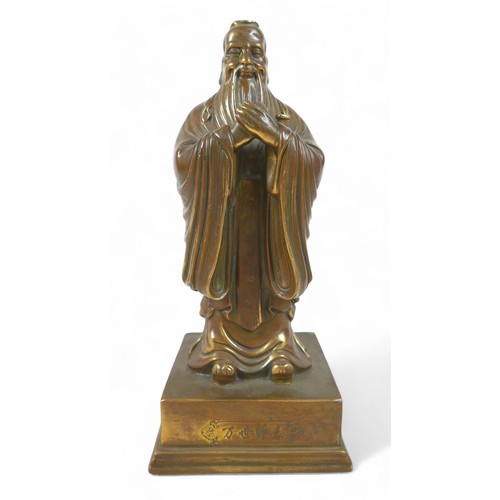 175 - A Chinese bronze figure, 13 by 11 by 29cm high.