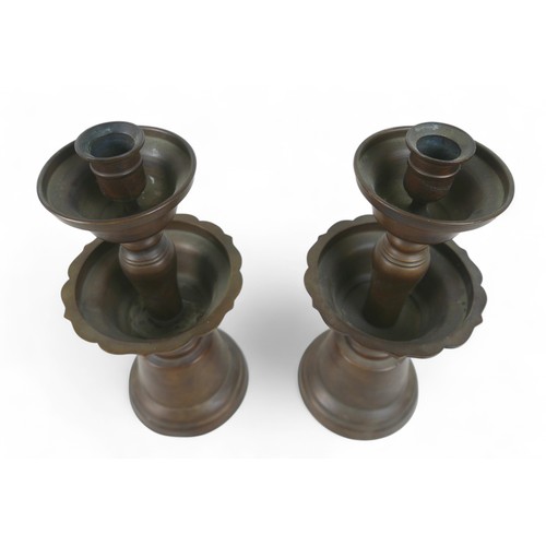 171 - A pair of oriental bell shaped altar candlesticks, made in Hong Kong, 14cm diameter by 33cm high.