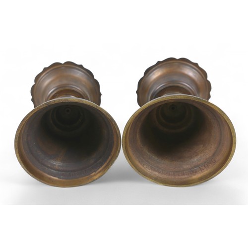 171 - A pair of oriental bell shaped altar candlesticks, made in Hong Kong, 14cm diameter by 33cm high.