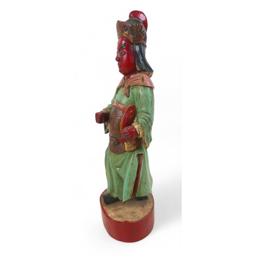 158 - A carved painted wooden figure, 15 by 13 by 47cm high.