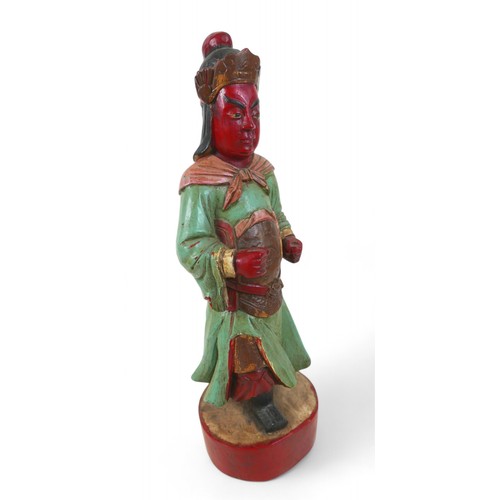 158 - A carved painted wooden figure, 15 by 13 by 47cm high.