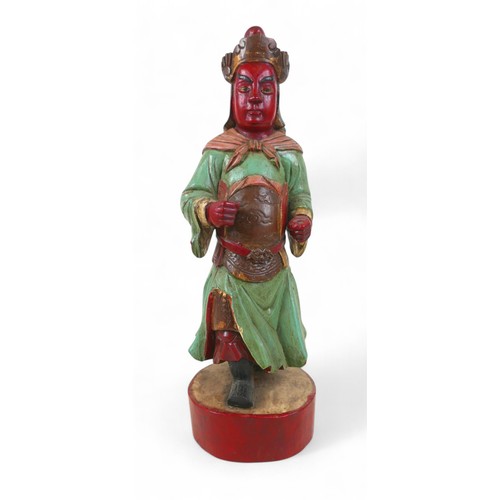 158 - A carved painted wooden figure, 15 by 13 by 47cm high.