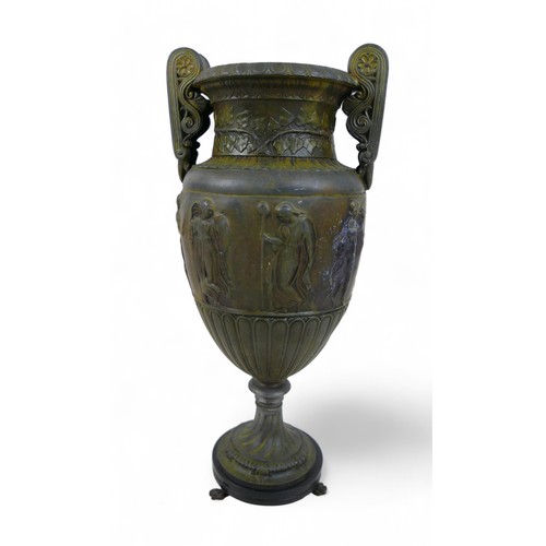 301 - A bronze effect classical style urn, 17 by 13 by 38cm.