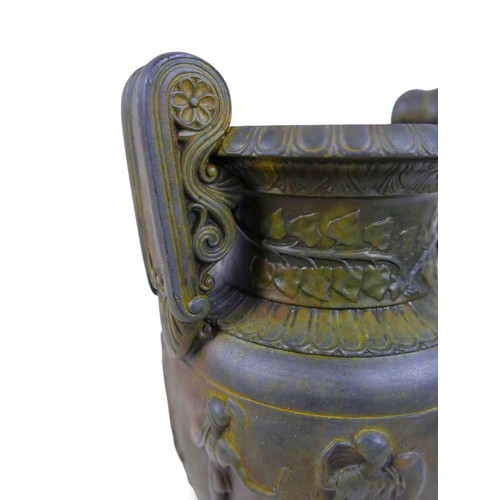 301 - A bronze effect classical style urn, 17 by 13 by 38cm.