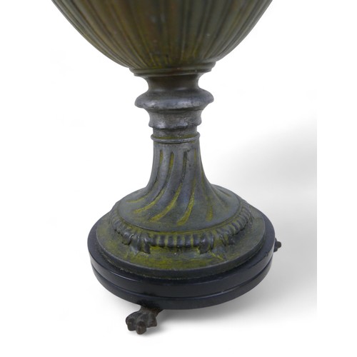 301 - A bronze effect classical style urn, 17 by 13 by 38cm.