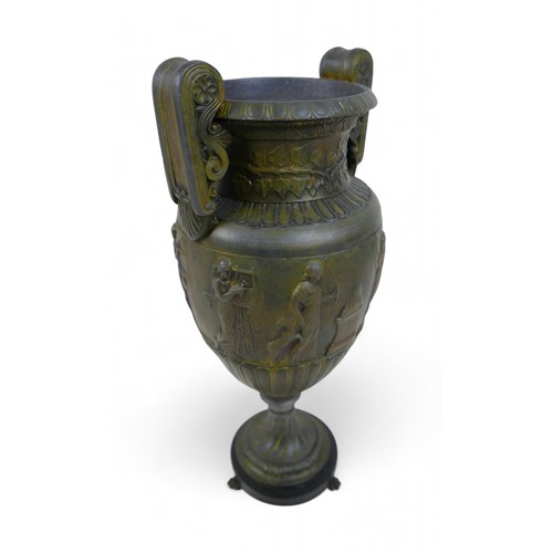 301 - A bronze effect classical style urn, 17 by 13 by 38cm.