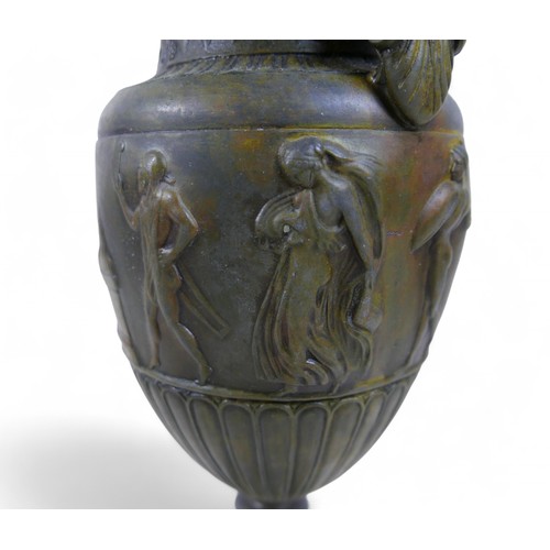 301 - A bronze effect classical style urn, 17 by 13 by 38cm.