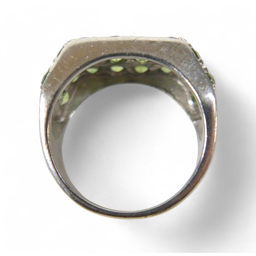 46 - A 9ct white gold green stone ring, size T, 10.3g.