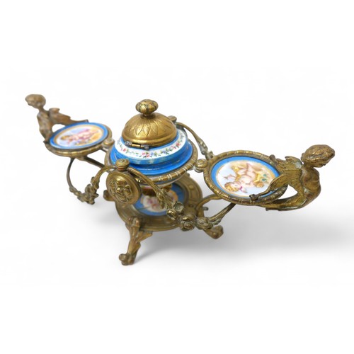 297 - A 19th century brass and porcelain desk inkstand, 29 by 15 by 15cm.