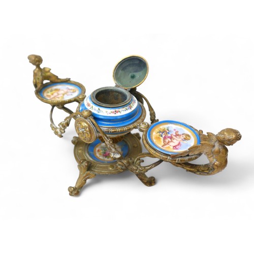 297 - A 19th century brass and porcelain desk inkstand, 29 by 15 by 15cm.