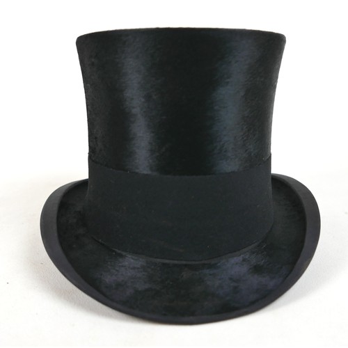 292 - An Edwardian silk top hat, internal measurement approx. 53cm, in a brown leather hat box.