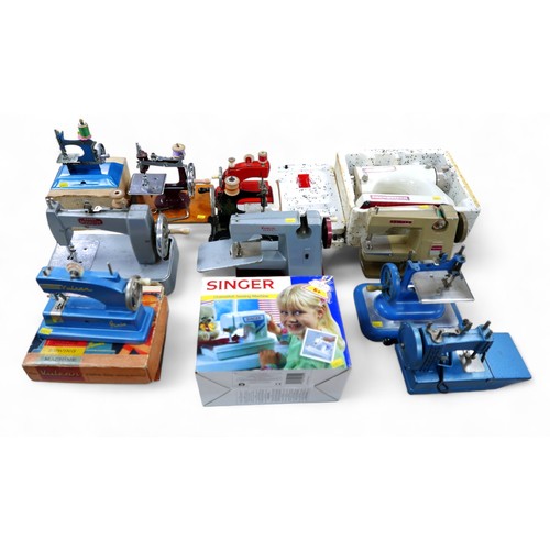 252 - An interesting collection of twelve Children's sewing machines. (12)