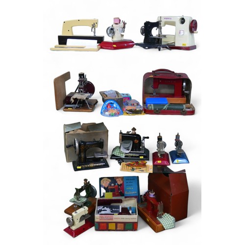 253 - An interesting collection of fourteen childs sewing machines, and accessories. (14)