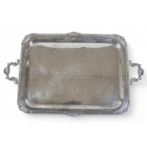 135 - A George V large silver twin handle presentation tray, with applied shell border, Harrison Brothers ... 