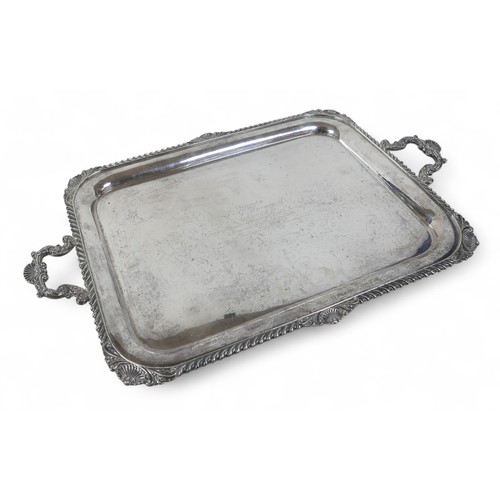 135 - A George V large silver twin handle presentation tray, with applied shell border, Harrison Brothers ... 