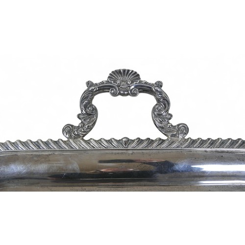 135 - A George V large silver twin handle presentation tray, with applied shell border, Harrison Brothers ... 