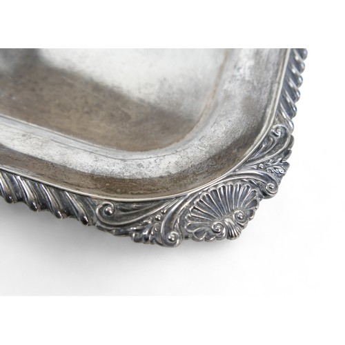 135 - A George V large silver twin handle presentation tray, with applied shell border, Harrison Brothers ... 