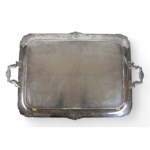 135 - A George V large silver twin handle presentation tray, with applied shell border, Harrison Brothers ... 