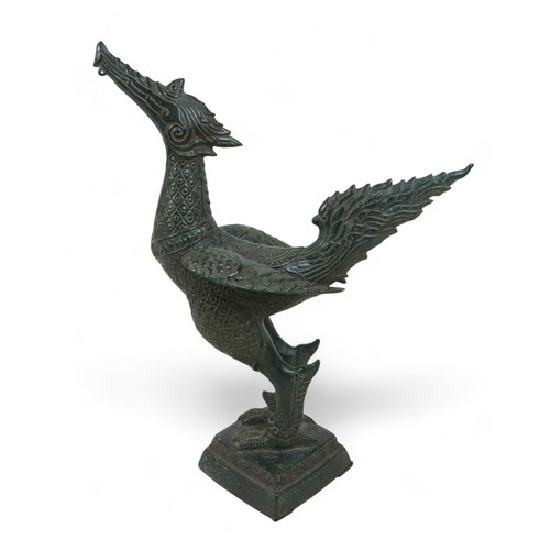 167 - A metal Airavata figure, a phoenix bird and a metal lidded container, the phoenix measures 28 by 13 ... 