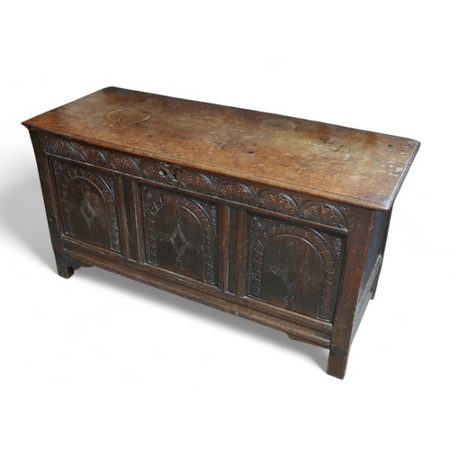 367 - An 18th century oak coffer, with a later carved front, 127 by 51 by 65cm high.