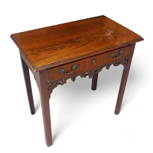 354 - A George III mahogany side table, with a drawer above a fret work frieze, 75 by 44 by 73cm high.