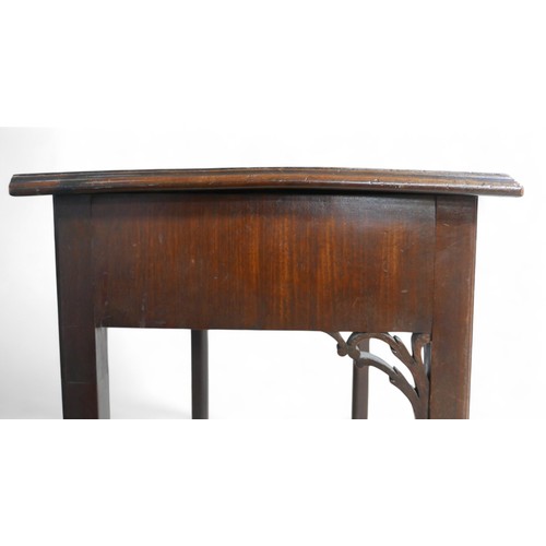 354 - A George III mahogany side table, with a drawer above a fret work frieze, 75 by 44 by 73cm high.