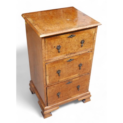 355 - A burr walnut three drawer chest, 50 by 44 by 85cm high.