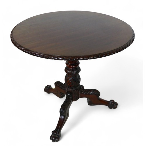 366 - A 19th century carved mahogany tilt top tripod table, 83cm diameter, 72cm high.