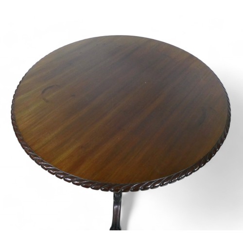 366 - A 19th century carved mahogany tilt top tripod table, 83cm diameter, 72cm high.