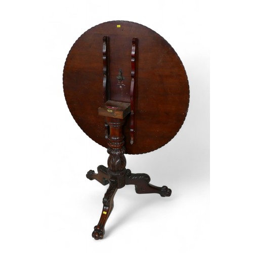 366 - A 19th century carved mahogany tilt top tripod table, 83cm diameter, 72cm high.