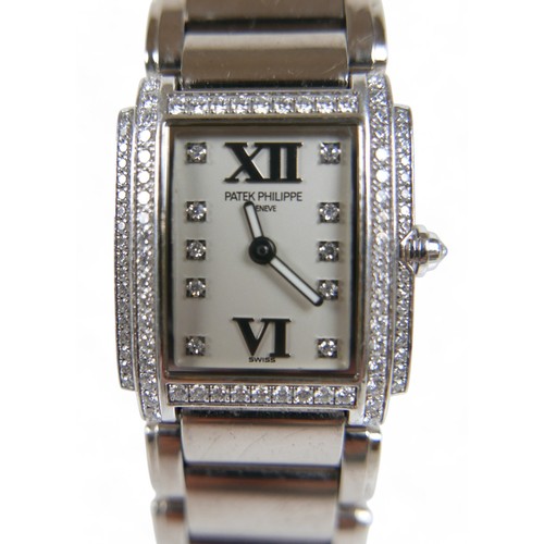 116 - A Patek Philippe ladies 18ct white gold diamond bracelet wristwatch, model TWENT-4 number 4908/200G-... 