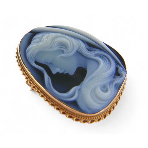 51 - A 9ct yellow gold blue agate cameo brooch, with pendant fitting 34 by 11 by 42mm, 14.0g.