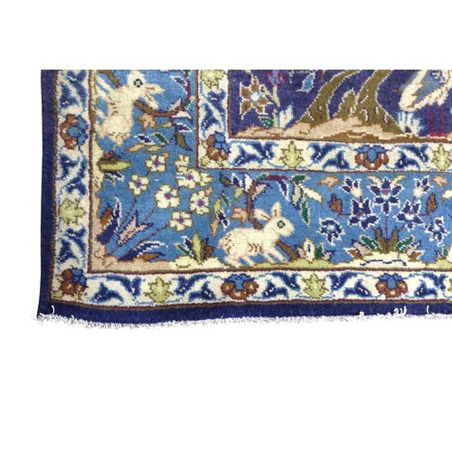 368 - A Kashmar rug, with blue ground and tree and life pattern, 294 by 194cm.