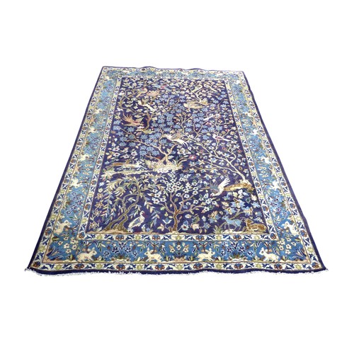 368 - A Kashmar rug, with blue ground and tree and life pattern, 294 by 194cm.