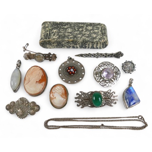 36 - A group of silver jewellery, including brooches, pendants and a chain. (1 bag)