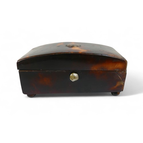 22 - A silver desk box and two small 19th century tortoiseshell boxes, largest 8.5 by 8 by 3cm.