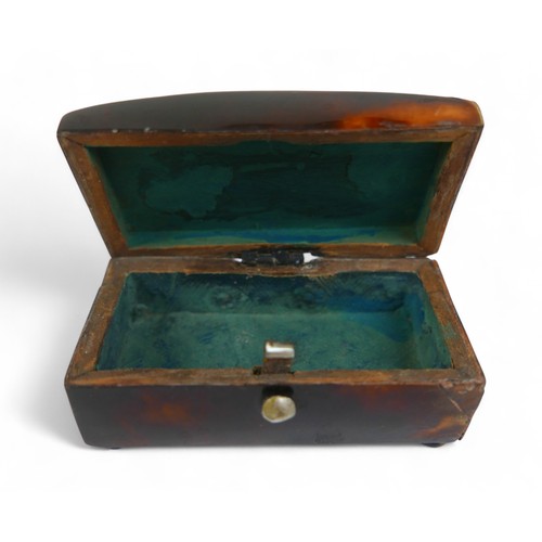 22 - A silver desk box and two small 19th century tortoiseshell boxes, largest 8.5 by 8 by 3cm.