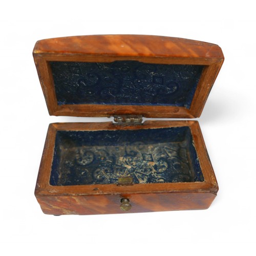 22 - A silver desk box and two small 19th century tortoiseshell boxes, largest 8.5 by 8 by 3cm.