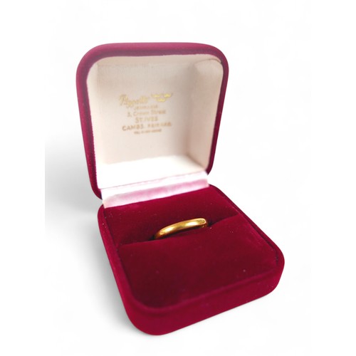 81 - A 22ct gold wedding band, slight bend in the band, size N, 2.2g, boxed.