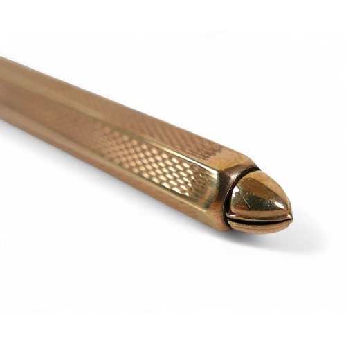 80 - A 9ct yellow gold toothpick, with sprung release, 8cm long, total weight 5.8g.