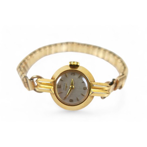 104 - An 18ct yellow gold ladies Longines watch, manual wind, 18mm case on a gold plated sprung strap, tot... 